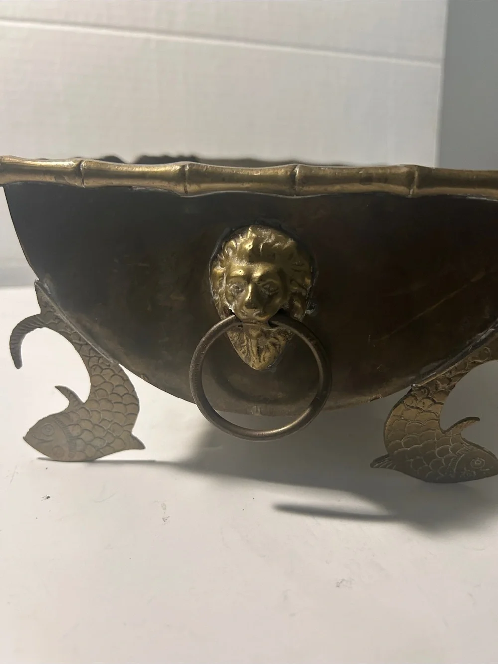 Planter metal with fish legs and lion heads on the side